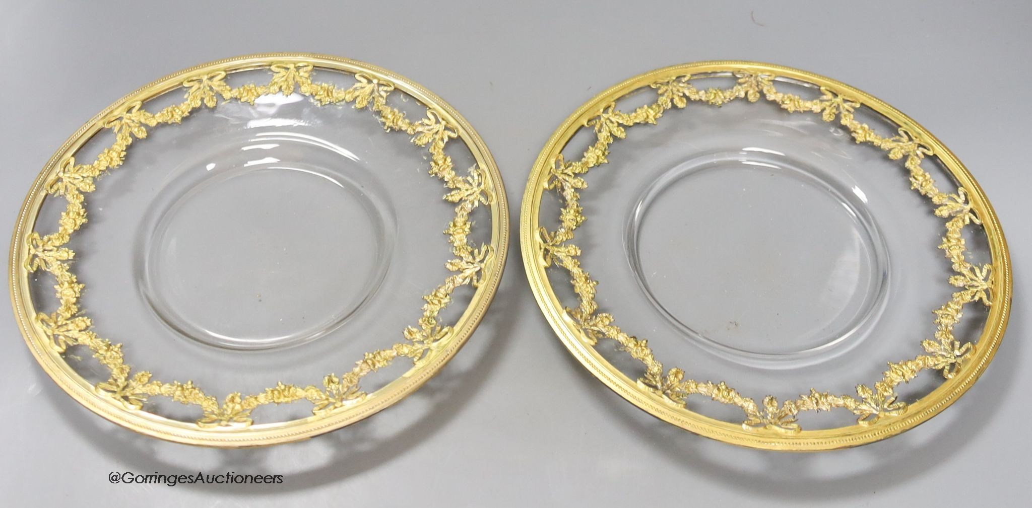 A pair of 19th century ormolu mounted glass dishes, in French Empire style, diameter 23cm